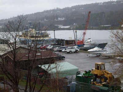 From the IRKPA:  &quot;Lots of activity this drizzly day at Isle Royale HQ as the LCM (Landing Craft Mechanized) prepares to haul boats and equipment to the island tomorrow. The crane on the barge docked to the right of the Ranger III is loading the LCM alongside.&quot;